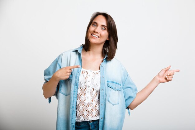 Portrait of young beautiful girl over white background