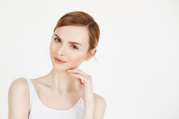 Portrait of young beautiful girl with natural make up smiling . Health and beauty lifestyle.