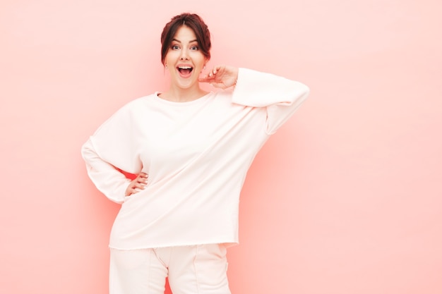 Portrait of young beautiful smiling female in trendy summer hipster clothes