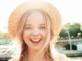 Free photo portrait of young beautiful smiling hipster girl in trendy summer sundress