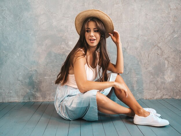 Portrait of Young beautiful smiling woman looking . Trendy girl in casual summer clothes. 