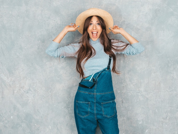 Portrait of Young beautiful surprised woman looking . Trendy girl in casual summer clothes. Shocked .