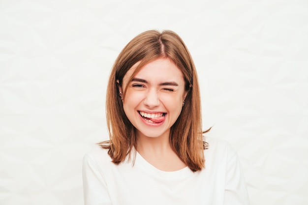 Portrait of young beautiful woman looking at camera.Trendy female smiling in casual summer hipster clothes