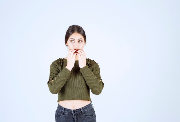 Portrait of a young beautiful woman model feeling scared