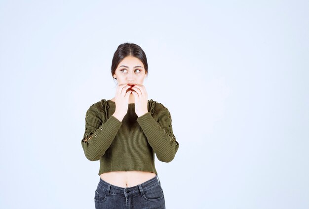 Portrait of a young beautiful woman model feeling scared