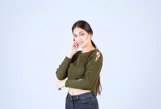 Portrait of a young beautiful woman model happily posing