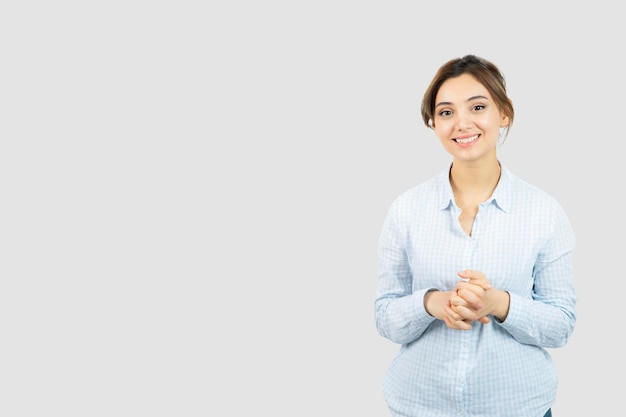 Free photo portrait of a young beautiful woman standing and smiling at camera . high quality photo