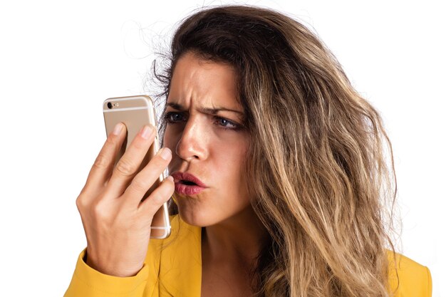 Portrait of young beautiful woman using her mobile phone