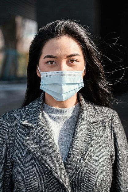 Portrait young beautiful woman wearing mask