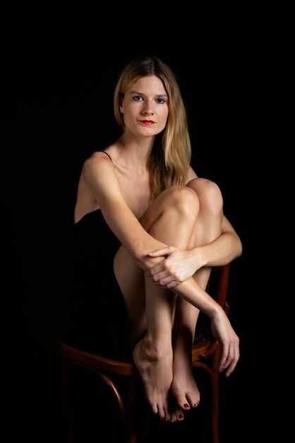 Portrait of young beautiful woman with black dress