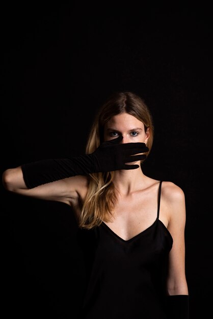 Portrait of young beautiful woman with black dress