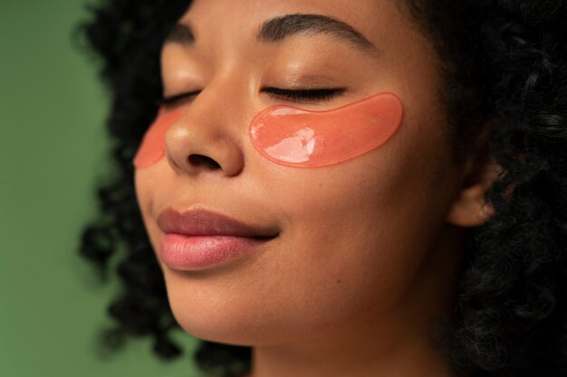 Portrait of young beautiful woman with eye patches