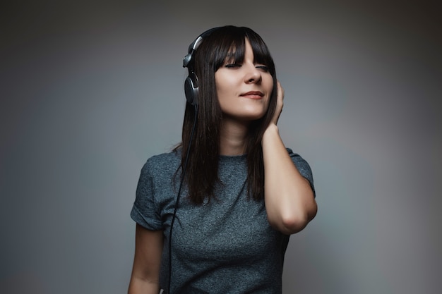 Portrait of young beautiful woman with headphones