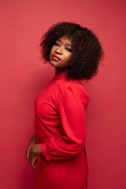 Portrait of young beautiful woman with red dress