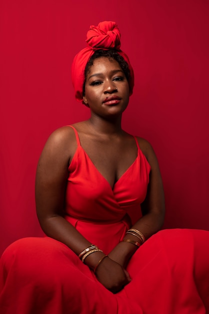 Portrait of young beautiful woman with red dress