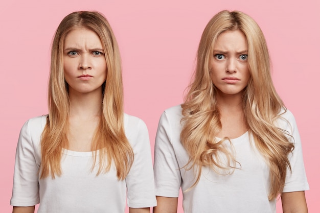 Portrait of young blonde female friends posing