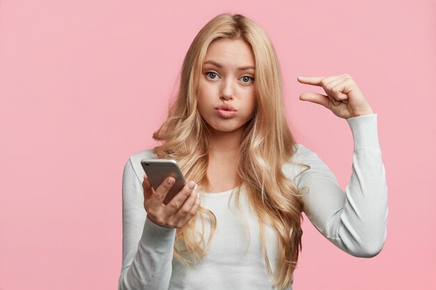 Portrait of young blonde woman posing