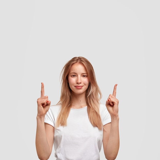 Portrait of young blonde woman in white T-shirt