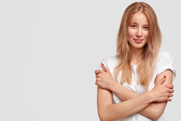 Portrait of young blonde woman in white T-shirt