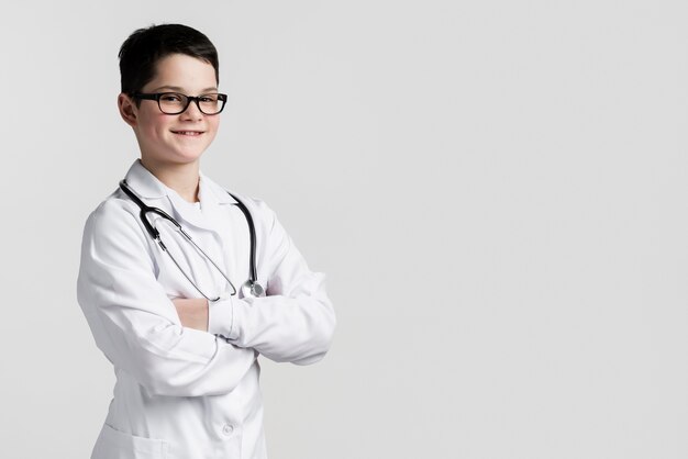 Portrait of young boy dressed up as medic