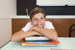 Free photo portrait of young boy smiling at home