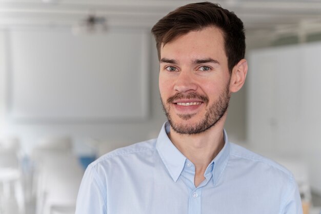 Portrait of young business man posing with crossed arms