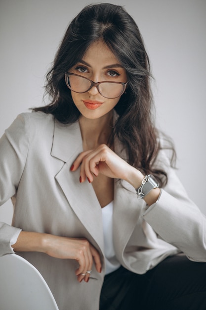 Portrait of a young business woman sitting in office