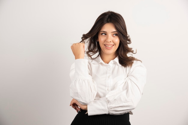 Portrait of young businesswoman on white.