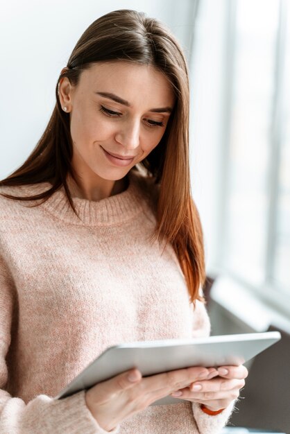 Portrait young businesswoman with tablet