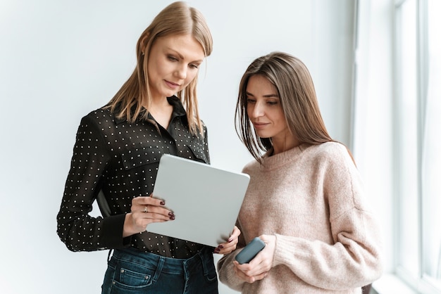 Portrait young businesswomen with tablet