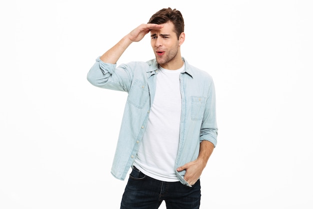 Portrait of a young casual man looking far away