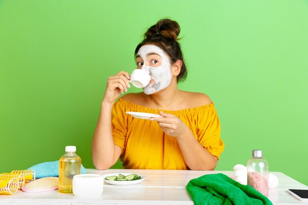 Portrait of young caucasian woman in beauty day, skin and hair care routine.