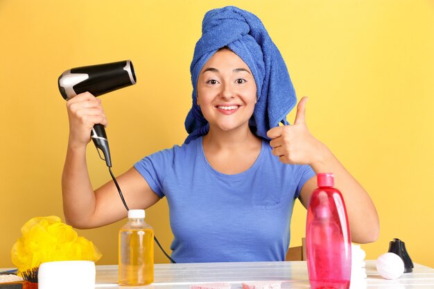 Portrait of young caucasian woman in her beauty day, skin and hair care routine.