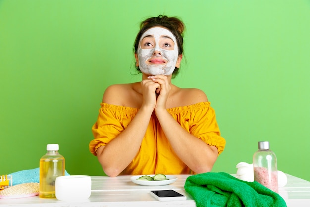 Portrait of young caucasian woman in her beauty day, skin and hair care routine