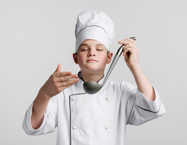 Portrait of young chef dressed up as chef