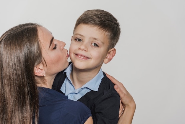 Free photo portrait of young child with mom