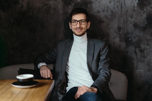 Portrait young, confident businessman wearing glasses