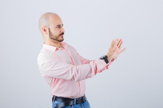 Portrait of a young confident man showing stop gesture