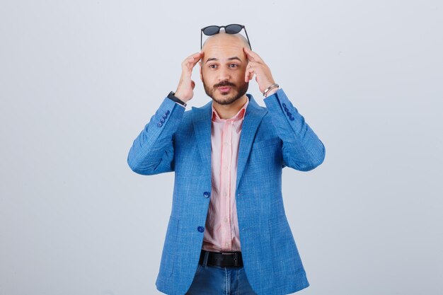 Portrait of a young confident man wearing sunglasses