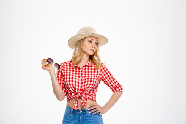 Portrait of young country woman  on white.