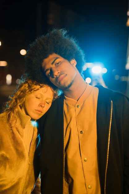 Portrait of young couple going out at night