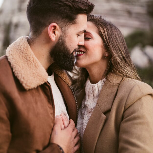 Portrait of young couple kissing