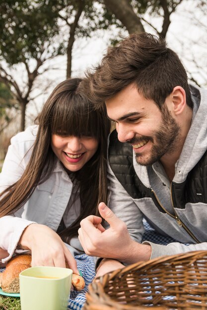 Portrait of young couple at picnic