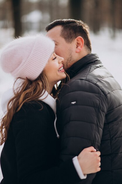 Portrait of a young couple together in winter on valentines day