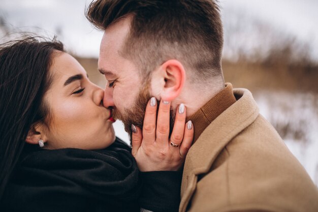 Portrait of young couple in winter park