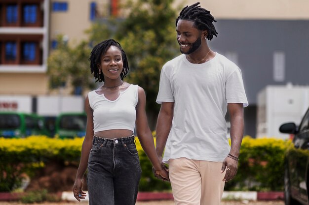 Portrait of young couple with afro dreadlocks outdoors