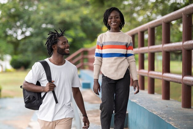 portrait of young couple with afro dreadlocks outdoors