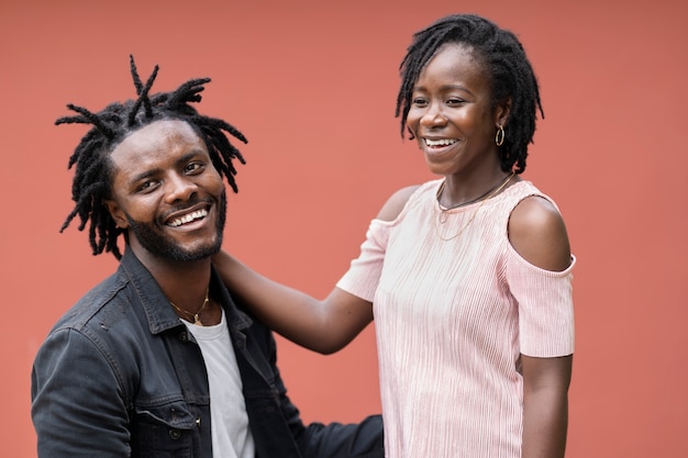 Portrait of young couple with afro dreadlocks