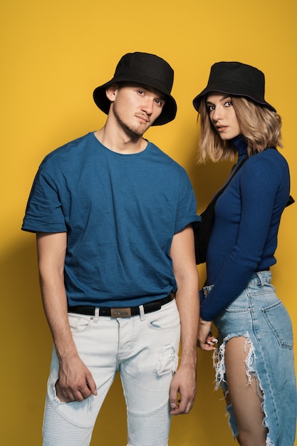 Portrait young couple on yellow