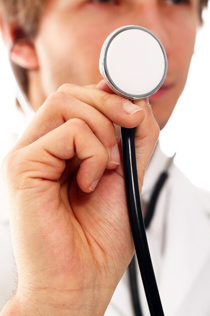 portrait of young doctor man with stroboscope